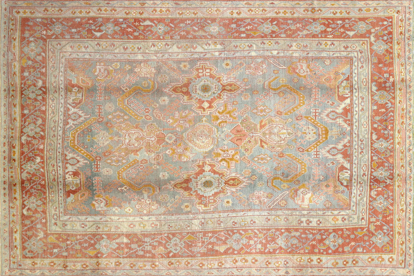 Vintage handwoven rugs from the Oushak region of Turkey.