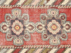 Vintage Turkish Oushak Rug in Red tones and an Medallion pattern. Measuring 3 feet 0 inches x 9 feet 9 inches – SKU 150985